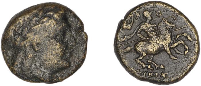 Colophon Kinns 1980 Period II, AE 14, реверс, bm